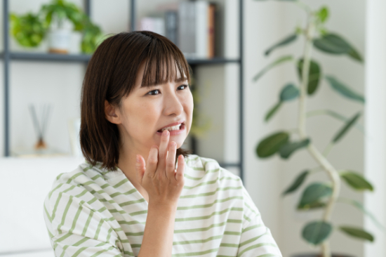虫歯になった女性